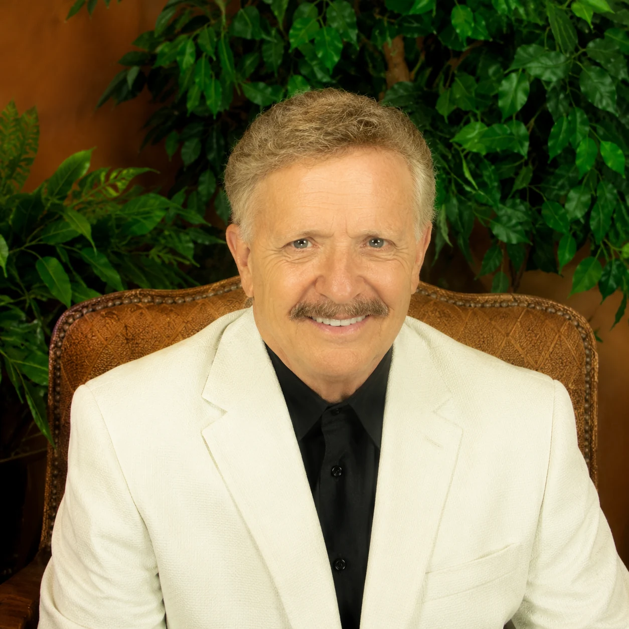 Portrait of David Arrington in a white jacket