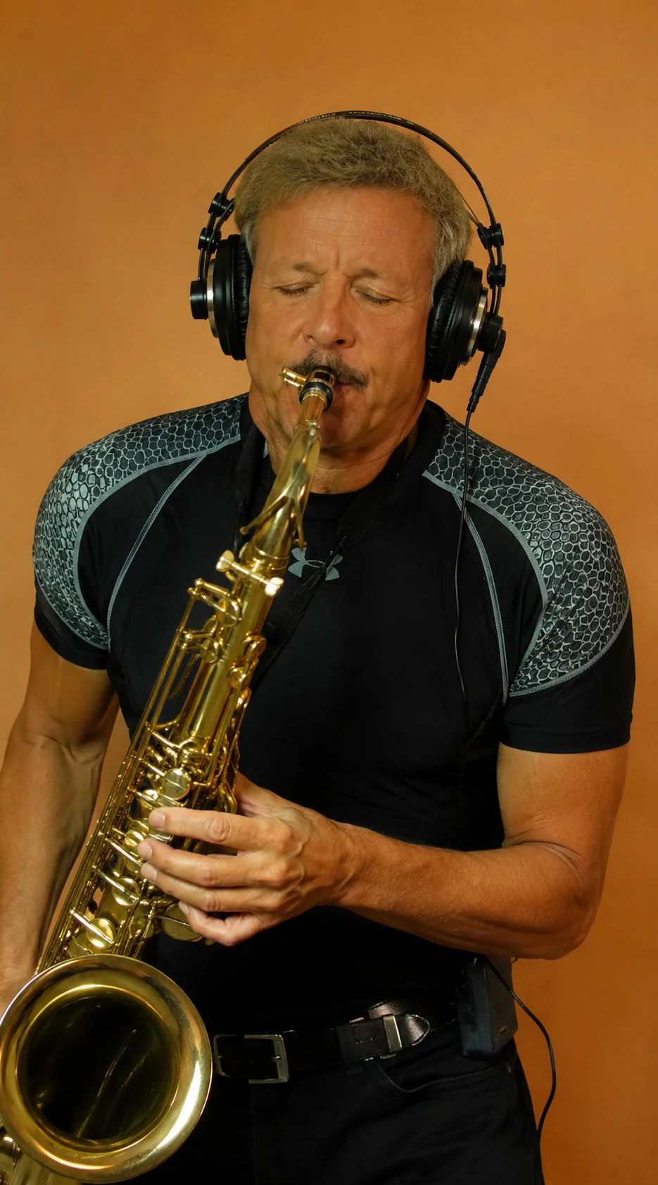 David Arrington playing saxophone in the studio